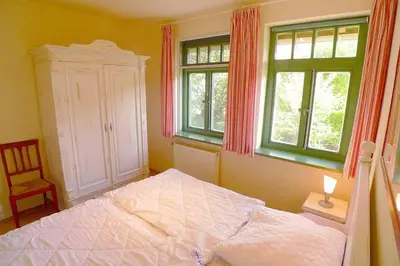 Ein Bett oder Betten in einem Zimmer der Unterkunft Ferienhaussiedlung Strandperlen Weidenhof 3a (Typ VIII)