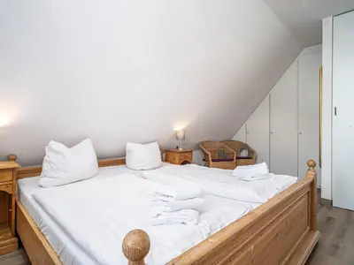 Ein Bett oder Betten in einem Zimmer der Unterkunft Ferienhaussiedlung Strandperlen Weidenhof 4a (Typ III)
