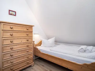 Ein Bett oder Betten in einem Zimmer der Unterkunft Ferienhaussiedlung Strandperlen Weidenhof 4a (Typ III)