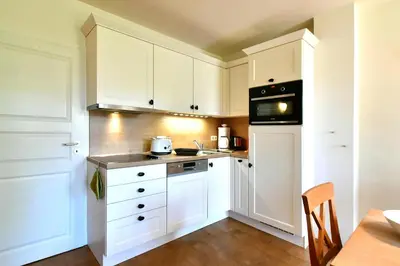 Küche/Küchenzeile in der Unterkunft Ferienhaussiedlung Strandperlen Sanddornhof 7b (Typ VI)