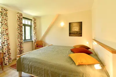 Ein Bett oder Betten in einem Zimmer der Unterkunft Ferienhaussiedlung Strandperlen Sanddornhof 7b (Typ VI)