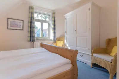 Ein Bett oder Betten in einem Zimmer der Unterkunft Ferienhaussiedlung Strandperlen Sanddornhof 7c (Typ II)