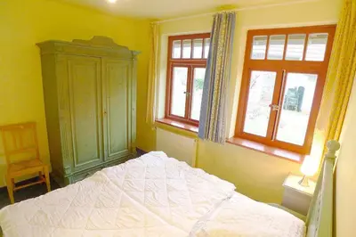 Ein Bett oder Betten in einem Zimmer der Unterkunft Ferienhaussiedlung Strandperlen Sanddornhof 2a (Typ VIII)