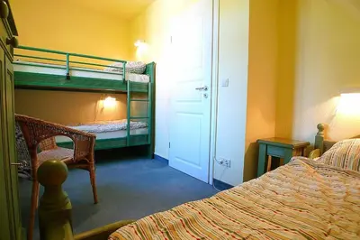 Ein Bett oder Betten in einem Zimmer der Unterkunft Ferienhaussiedlung Strandperlen Sanddornhof 2a (Typ VIII)