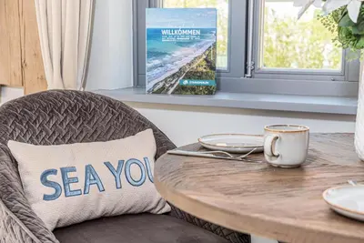 Ein Sitzbereich in der Unterkunft Ferienhaussiedlung Strandperlen Sanddornhof 2d (Typ I)