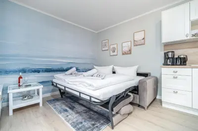 Ein Bett oder Betten in einem Zimmer der Unterkunft Ferienhaussiedlung Strandperlen Sanddornhof 2d (Typ I)