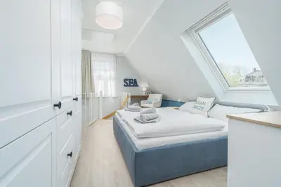 Ein Bett oder Betten in einem Zimmer der Unterkunft Ferienhaussiedlung Strandperlen Sanddornhof 2d (Typ I)