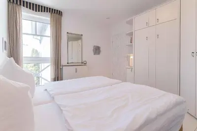 Ein Bett oder Betten in einem Zimmer der Unterkunft Haus zum Strand HAUS ZUM STRAND Whg 2.2