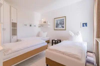 Ein Bett oder Betten in einem Zimmer der Unterkunft Haus zum Strand HAUS ZUM STRAND Whg 2.2