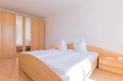 Ein Bett oder Betten in einem Zimmer der Unterkunft Haus zum Strand HAUS ZUM STRAND Whg 2.3