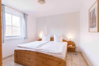 Ein Bett oder Betten in einem Zimmer der Unterkunft Haus WINDFLÜCHTER Whg. LF 6.1
