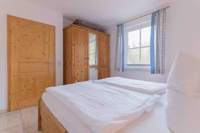 Ein Bett oder Betten in einem Zimmer der Unterkunft Haus WINDFLÜCHTER Whg. LF 6.1