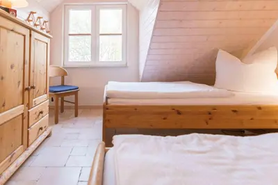 Ein Bett oder Betten in einem Zimmer der Unterkunft Haus WINDFLÜCHTER Whg. LF 6.2
