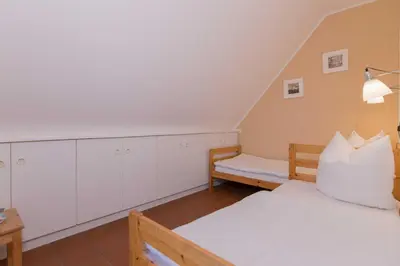 Ein Bett oder Betten in einem Zimmer der Unterkunft Haus LONGARD