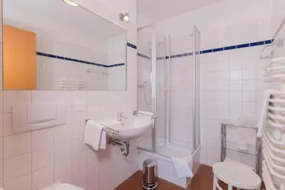 Ein Badezimmer in der Unterkunft Haus LONGARD