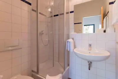 Ein Badezimmer in der Unterkunft Haus LONGARD