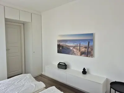 Ein Bett oder Betten in einem Zimmer der Unterkunft Ferienhaussiedlung Strandperlen Sanddornhof 7d (Typ I)