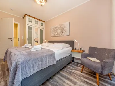 Ein Bett oder Betten in einem Zimmer der Unterkunft Suite Windböe