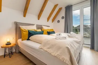 Ein Bett oder Betten in einem Zimmer der Unterkunft Suite Windrose