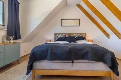 Ein Bett oder Betten in einem Zimmer der Unterkunft Suite Windrose