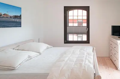 Ein Bett oder Betten in einem Zimmer der Unterkunft Hafenanker