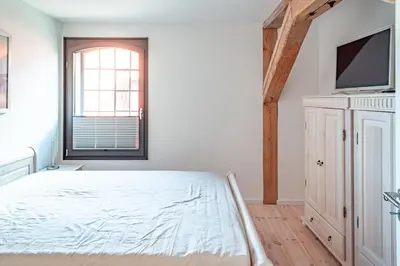 Ein Bett oder Betten in einem Zimmer der Unterkunft Hafenanker