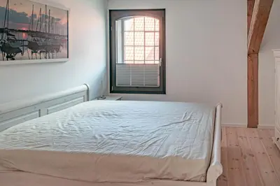 Ein Bett oder Betten in einem Zimmer der Unterkunft Hafenanker