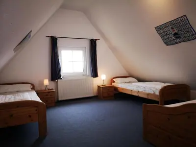 Ein Bett oder Betten in einem Zimmer der Unterkunft to Hus