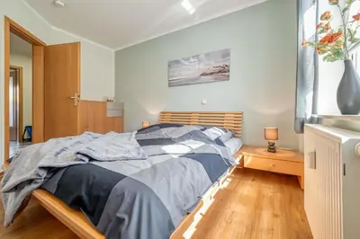 Ein Bett oder Betten in einem Zimmer der Unterkunft Friedenstraße 17 Whg 3