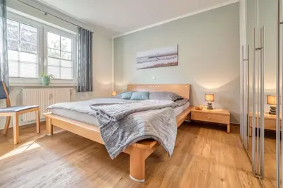 Ein Bett oder Betten in einem Zimmer der Unterkunft Friedenstraße 17 Whg 3
