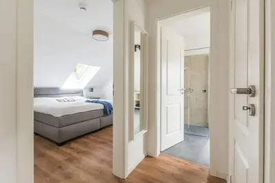 Ein Bett oder Betten in einem Zimmer der Unterkunft Suite Sünnenkringel