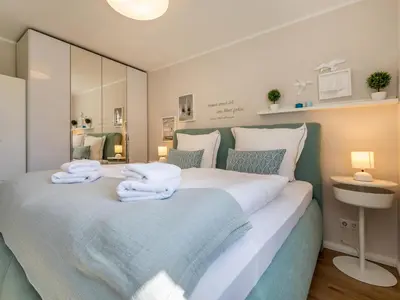 Ein Bett oder Betten in einem Zimmer der Unterkunft Meerliebe