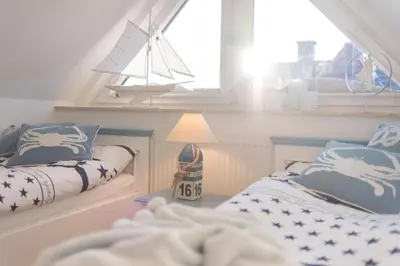 Ein Bett oder Betten in einem Zimmer der Unterkunft Sanddollar