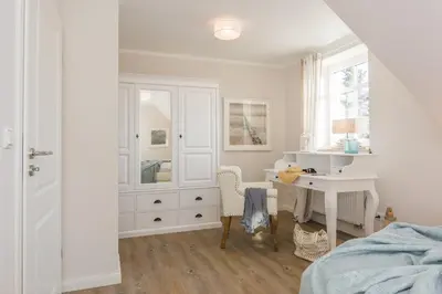 Ein Bett oder Betten in einem Zimmer der Unterkunft Sanddollar