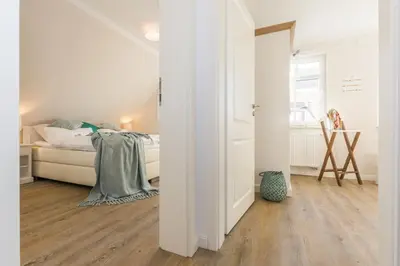 Ein Bett oder Betten in einem Zimmer der Unterkunft Sanddollar
