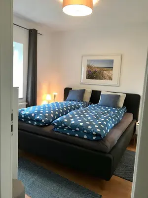 Ein Bett oder Betten in einem Zimmer der Unterkunft Die kleine Acht - direkt am Strand