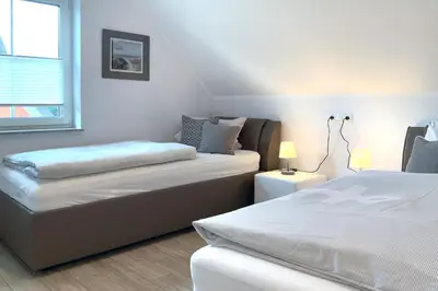 Ein Bett oder Betten in einem Zimmer der Unterkunft Kleiner Seehund