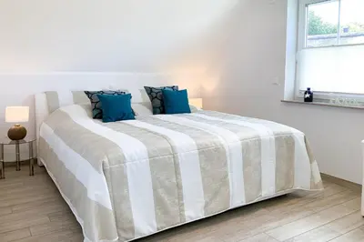 Ein Bett oder Betten in einem Zimmer der Unterkunft Kleiner Seehund