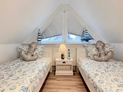 Ein Bett oder Betten in einem Zimmer der Unterkunft Meeresstern