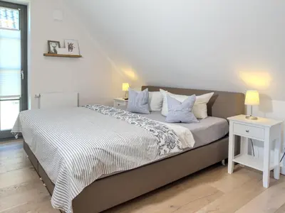 Ein Bett oder Betten in einem Zimmer der Unterkunft Strandglück