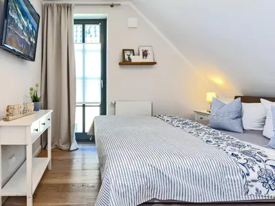 Ein Bett oder Betten in einem Zimmer der Unterkunft Strandglück