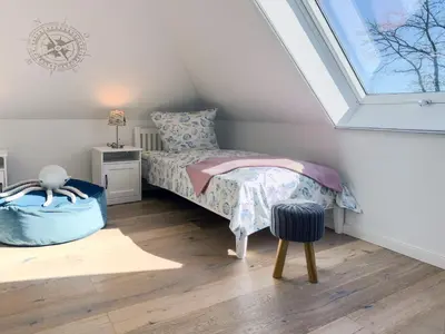 Ein Bett oder Betten in einem Zimmer der Unterkunft Strandglück