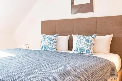 Ein Bett oder Betten in einem Zimmer der Unterkunft Residenz am Strand, Whg 242