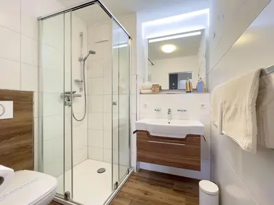 Ein Badezimmer in der Unterkunft Residenz am Strand, Whg 114