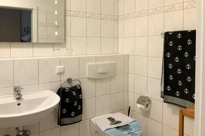 Ein Badezimmer in der Unterkunft Residenz am Strand, Whg 232