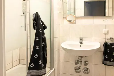 Ein Badezimmer in der Unterkunft Residenz am Strand, Whg 232