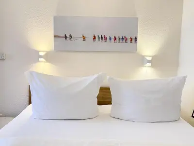 Ein Bett oder Betten in einem Zimmer der Unterkunft Residenz am Strand, Whg 238