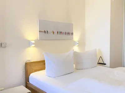 Ein Bett oder Betten in einem Zimmer der Unterkunft Residenz am Strand, Whg 238