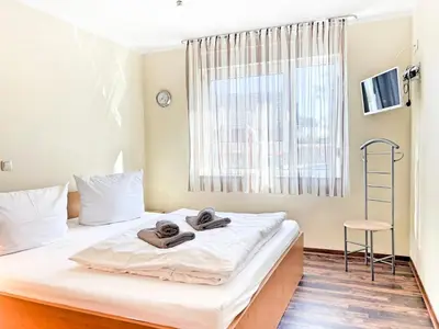 Ein Bett oder Betten in einem Zimmer der Unterkunft Residenz am Strand, Whg 567