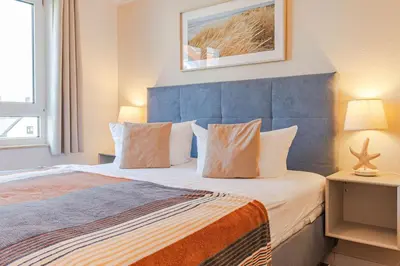 Ein Bett oder Betten in einem Zimmer der Unterkunft Residenz am Strand, Whg 677